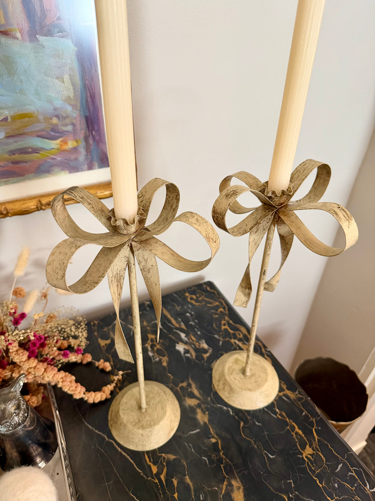 pair of cream tole ribbon candlesticks