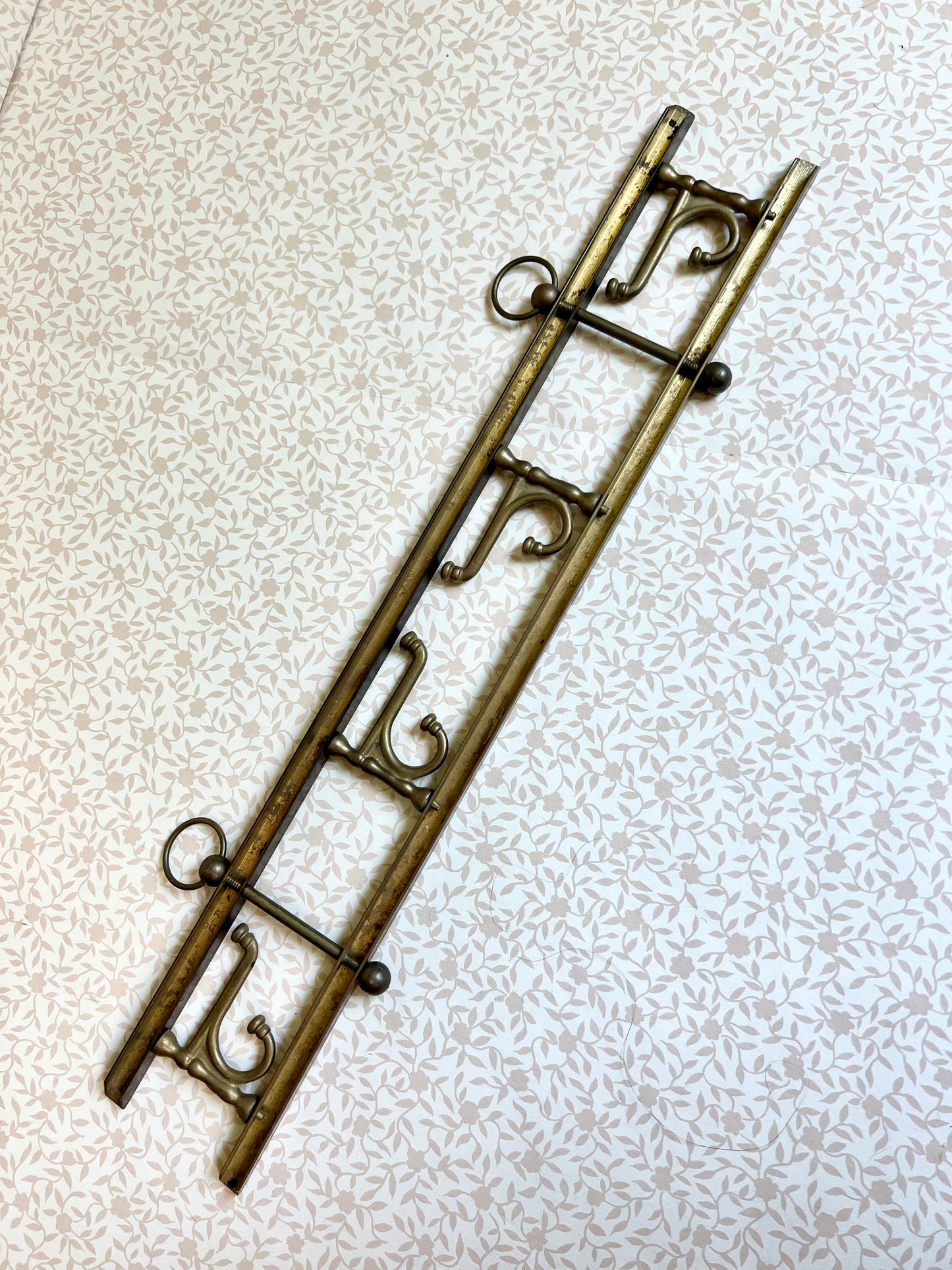 brass wall coat and hat rack