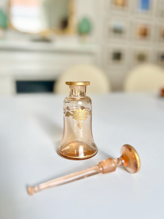 antique amber perfume bottle with gold detailing