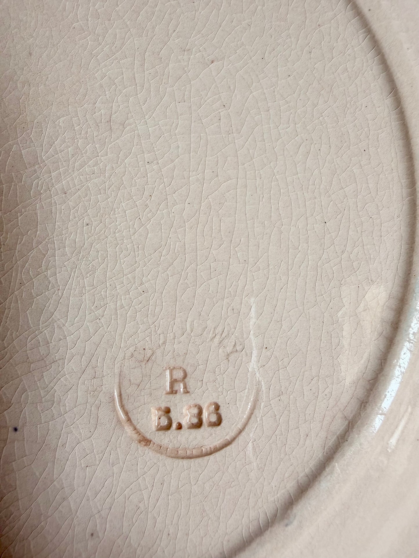 Longwy "Marly" earthenware plates with brown or blue transferware and a pierced basketweave border