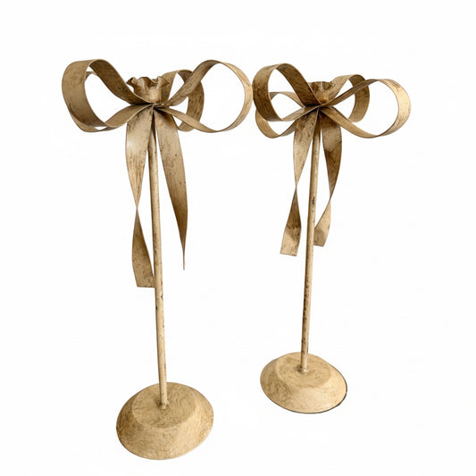 pair of cream tole ribbon candlesticks