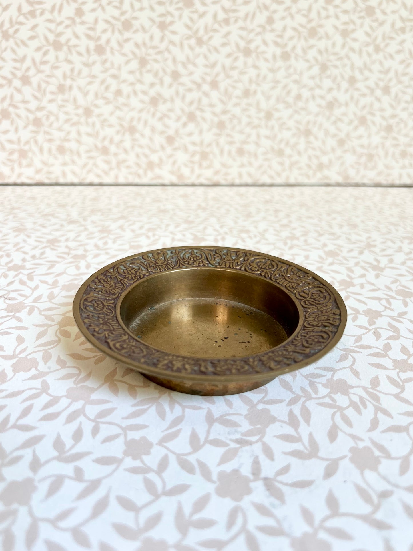 brass trinket dish with filigree detailed edge