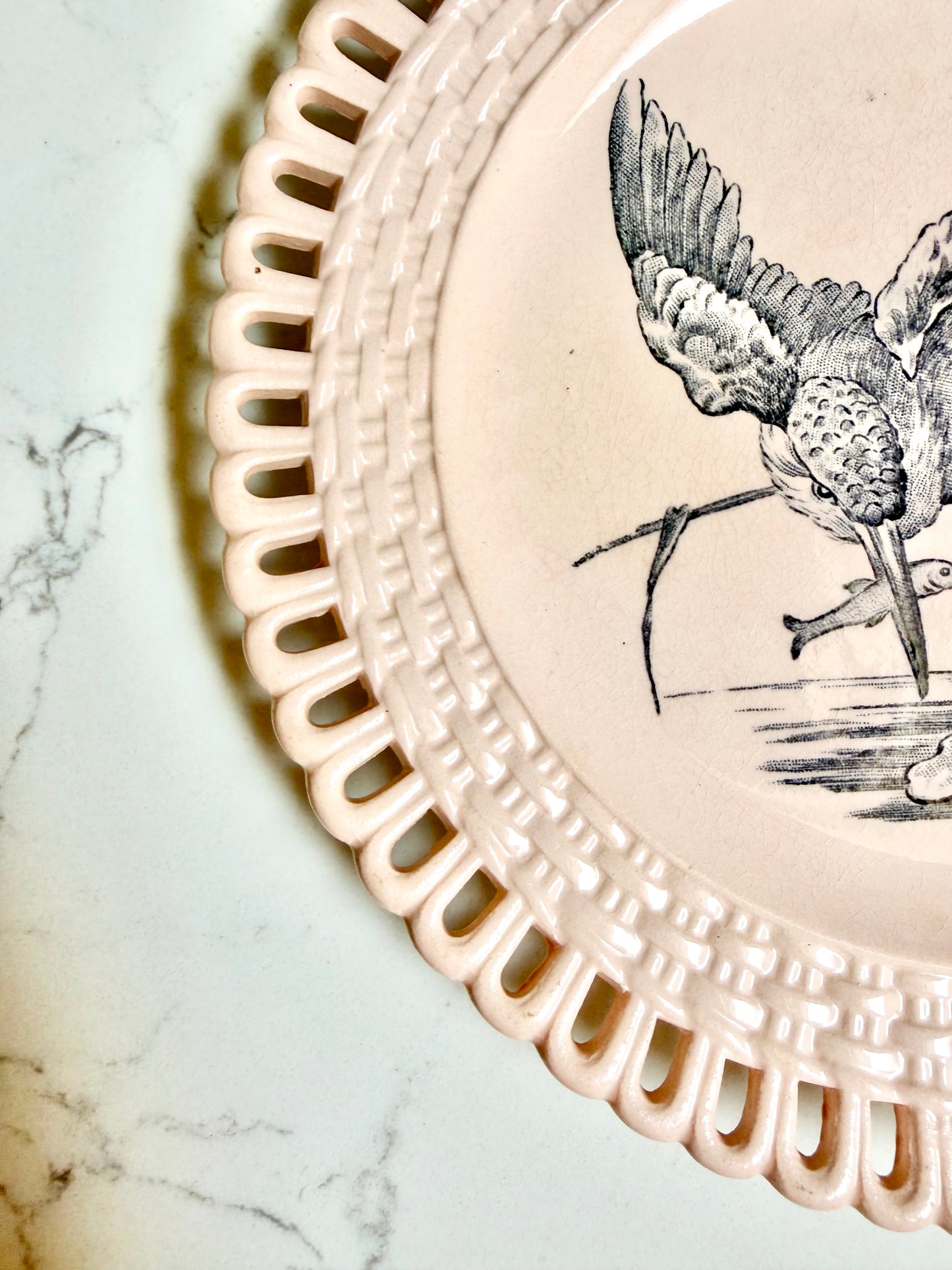Longwy "Marly" earthenware plates with brown or blue transferware and a pierced basketweave border