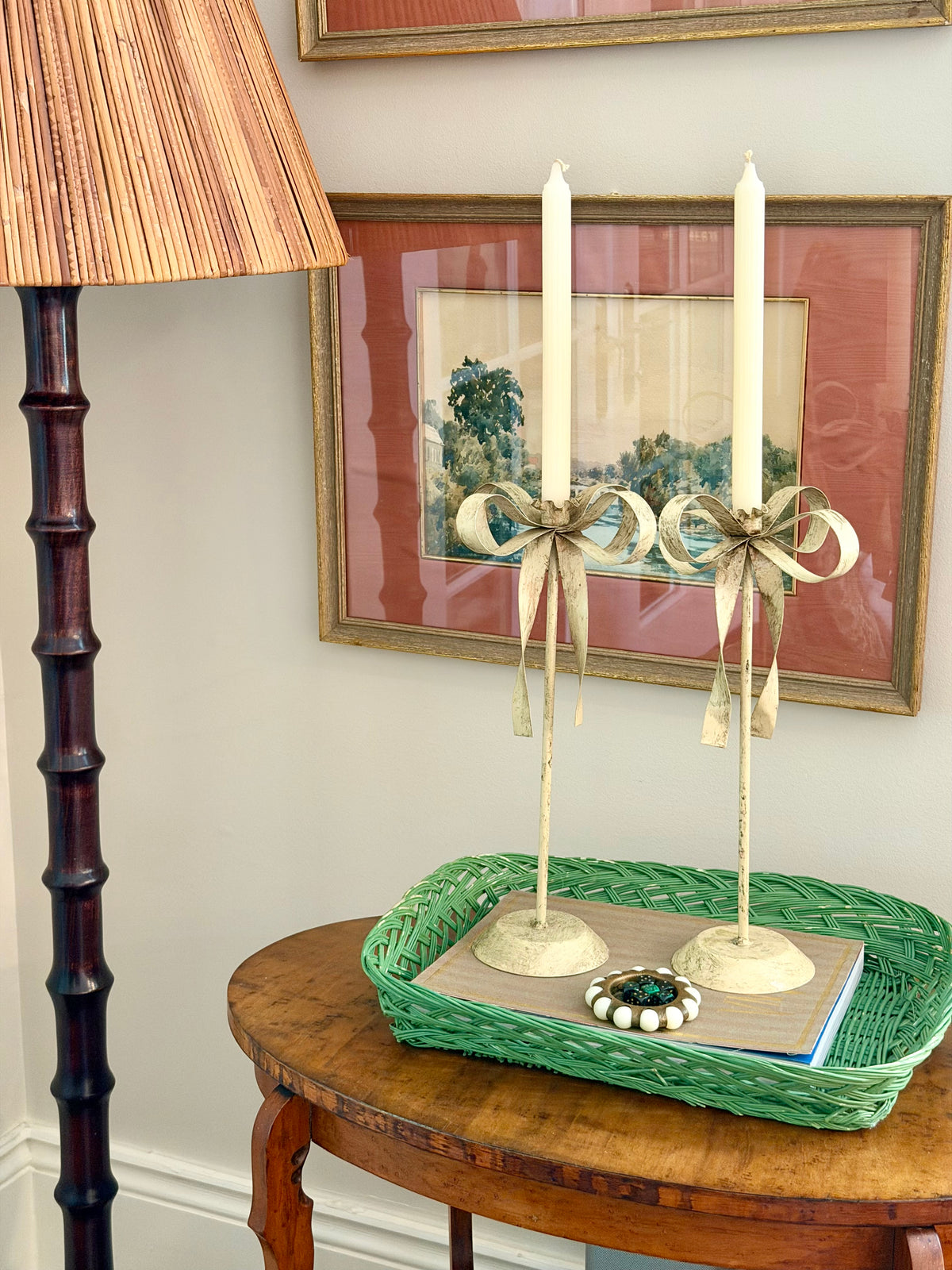 pair of cream tole ribbon candlesticks