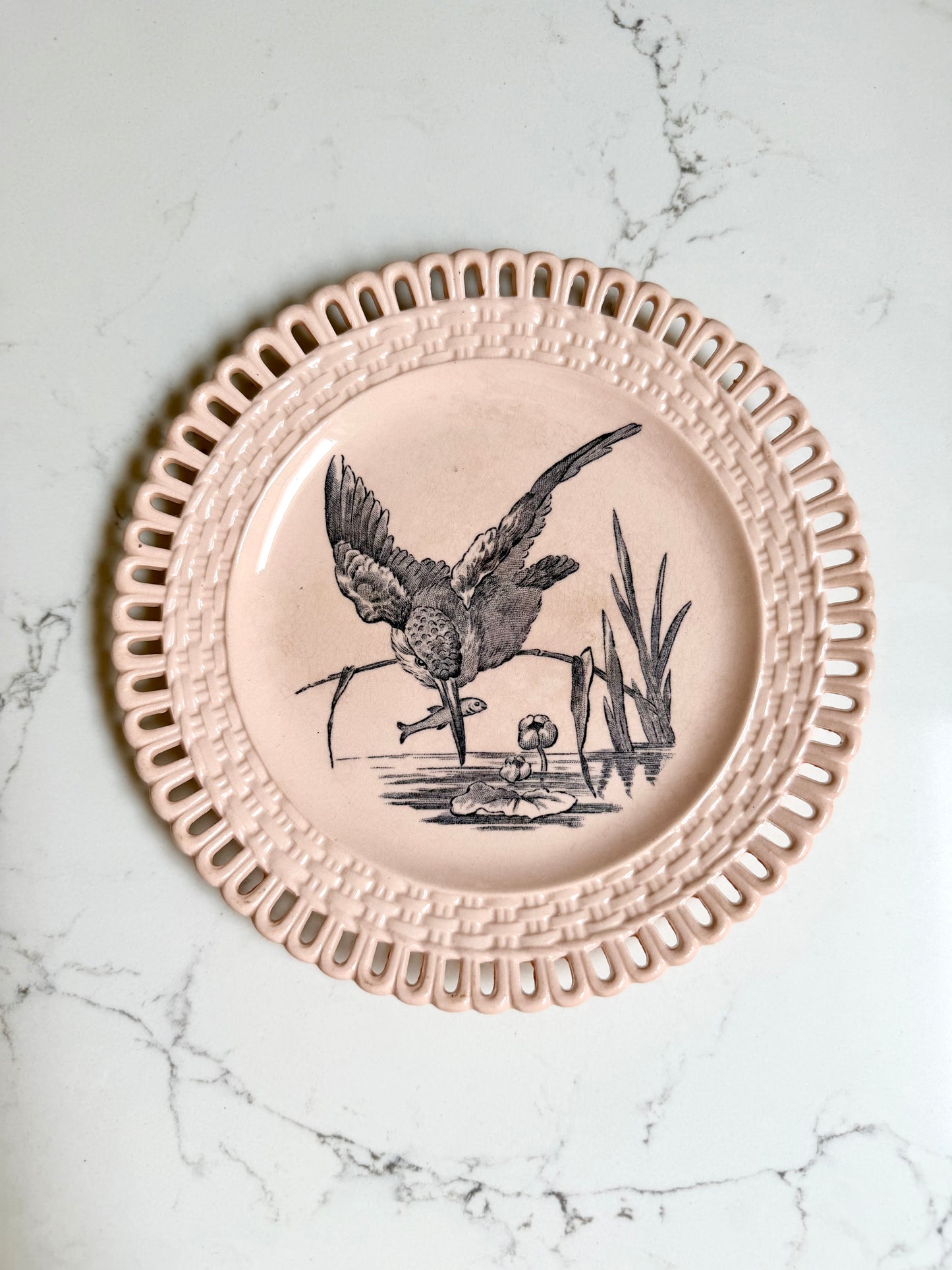 Longwy "Marly" earthenware plates with brown or blue transferware and a pierced basketweave border