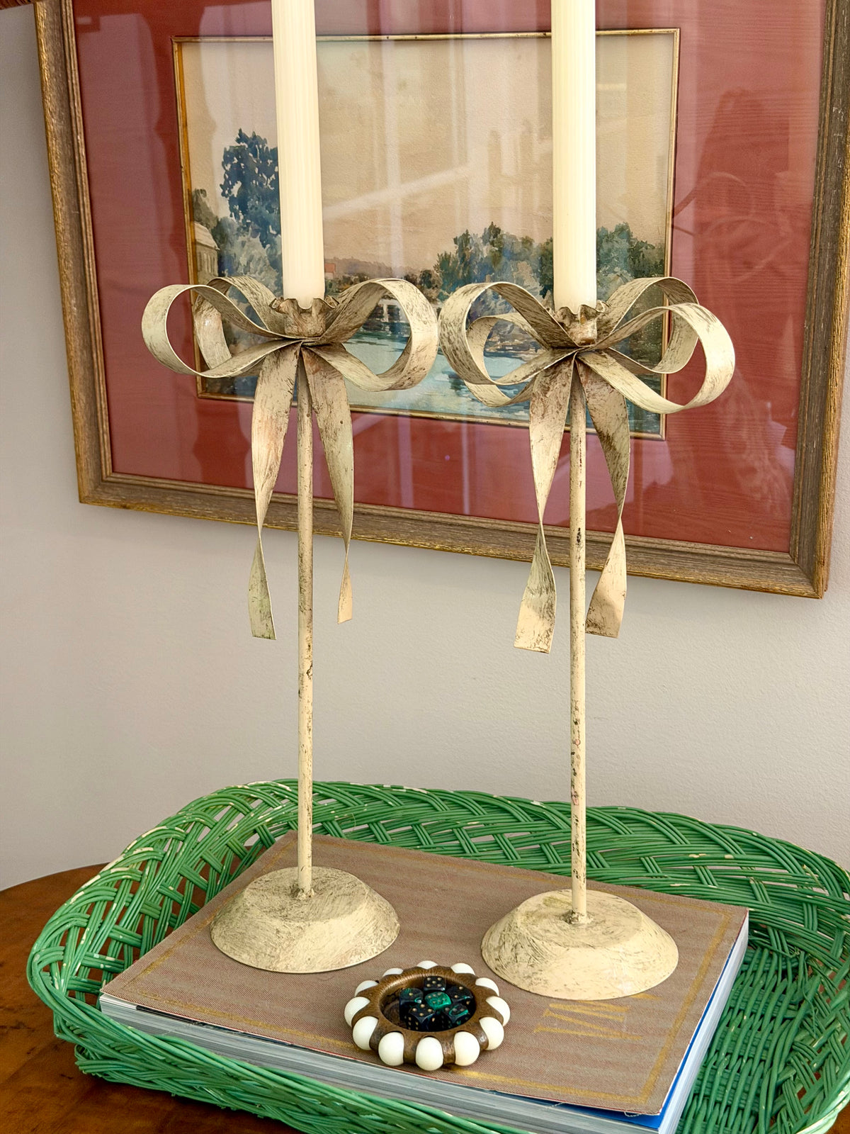 pair of cream tole ribbon candlesticks