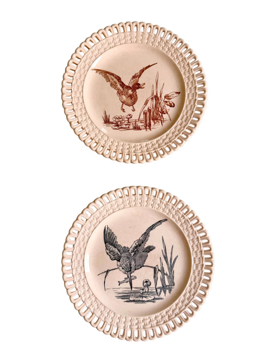 Longwy "Marly" earthenware plates with brown or blue transferware and a pierced basketweave border