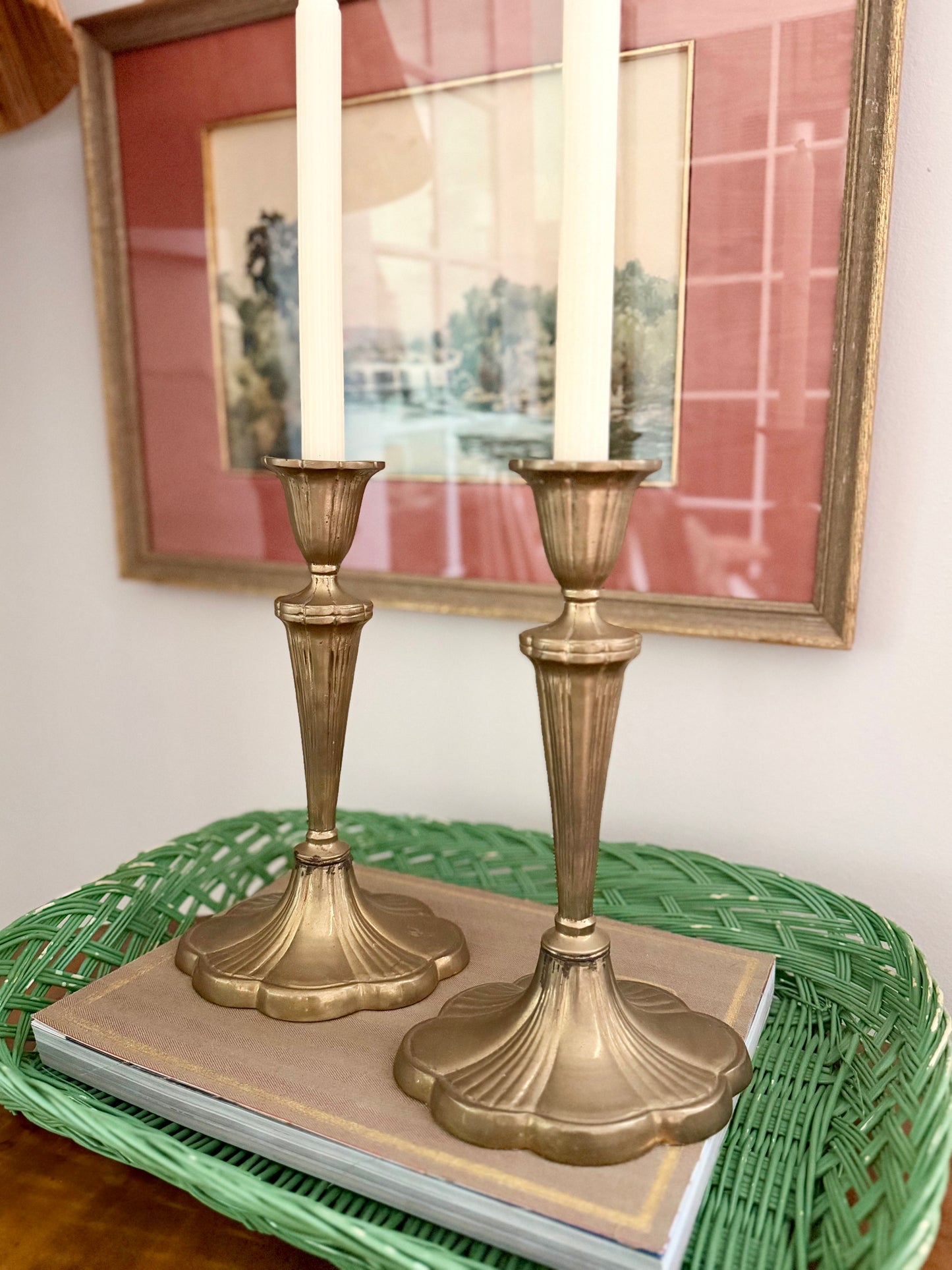 pair of brass candlesticks with a scalloped base