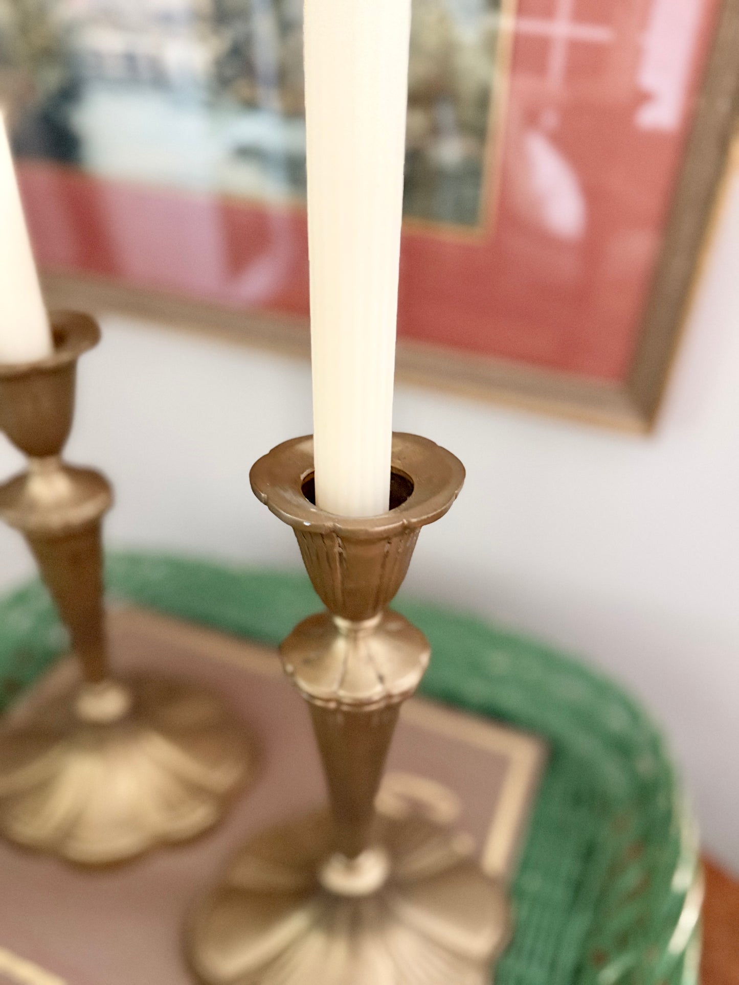 pair of brass candlesticks with a scalloped base