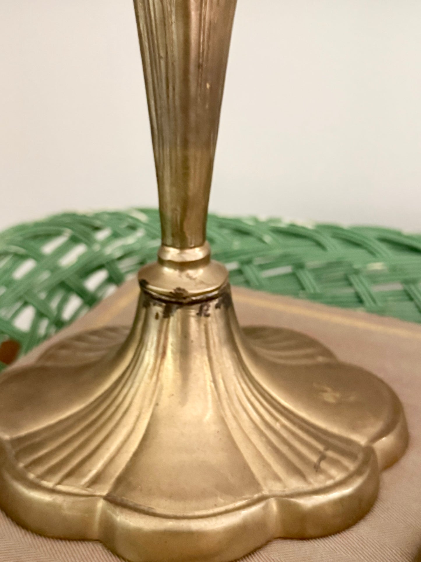 pair of brass candlesticks with a scalloped base