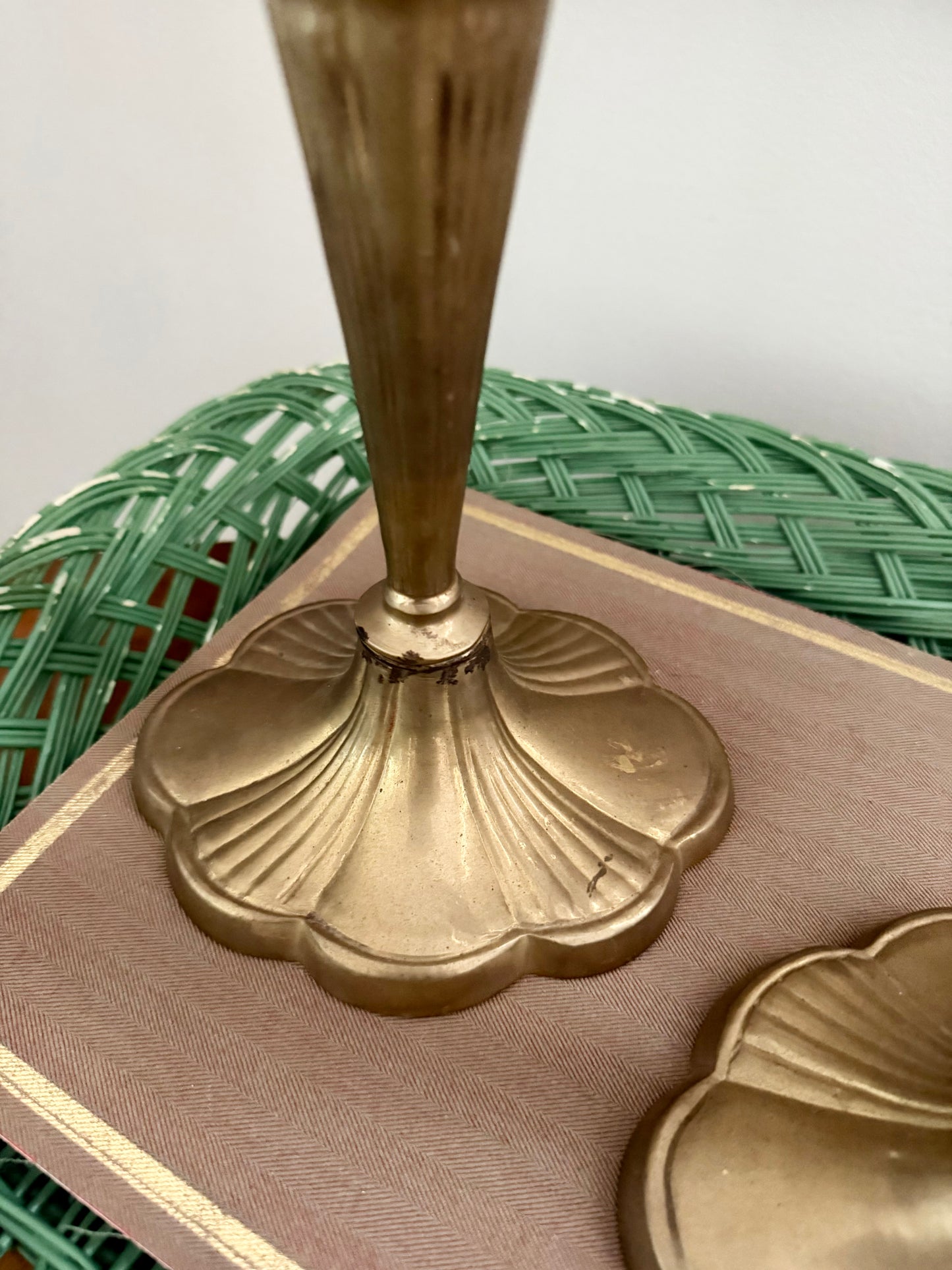 pair of brass candlesticks with a scalloped base