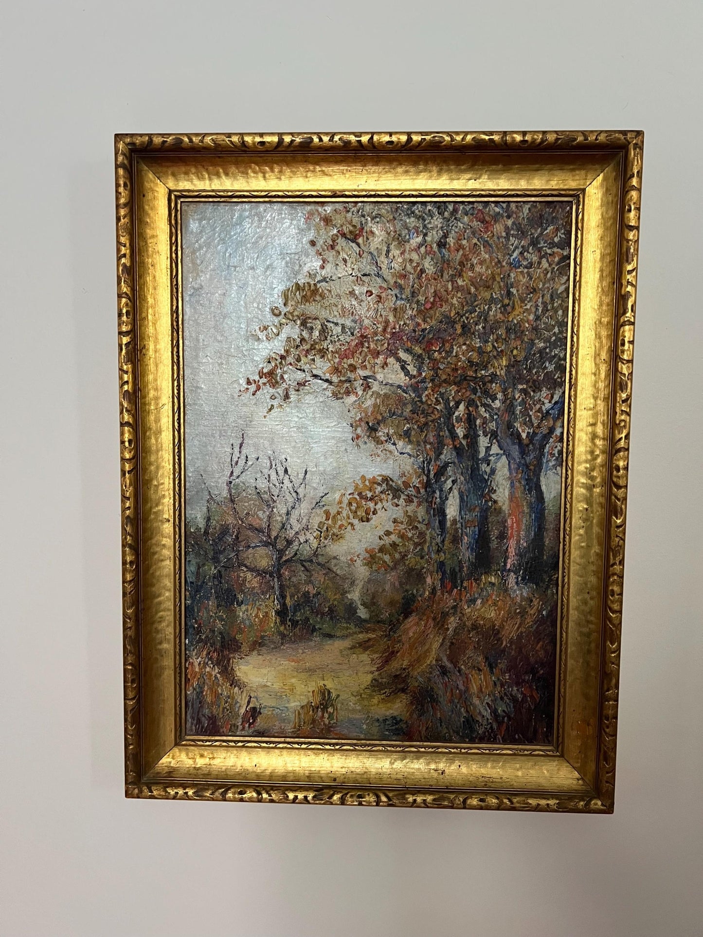 oil painting of fall trees in gold gilt frame