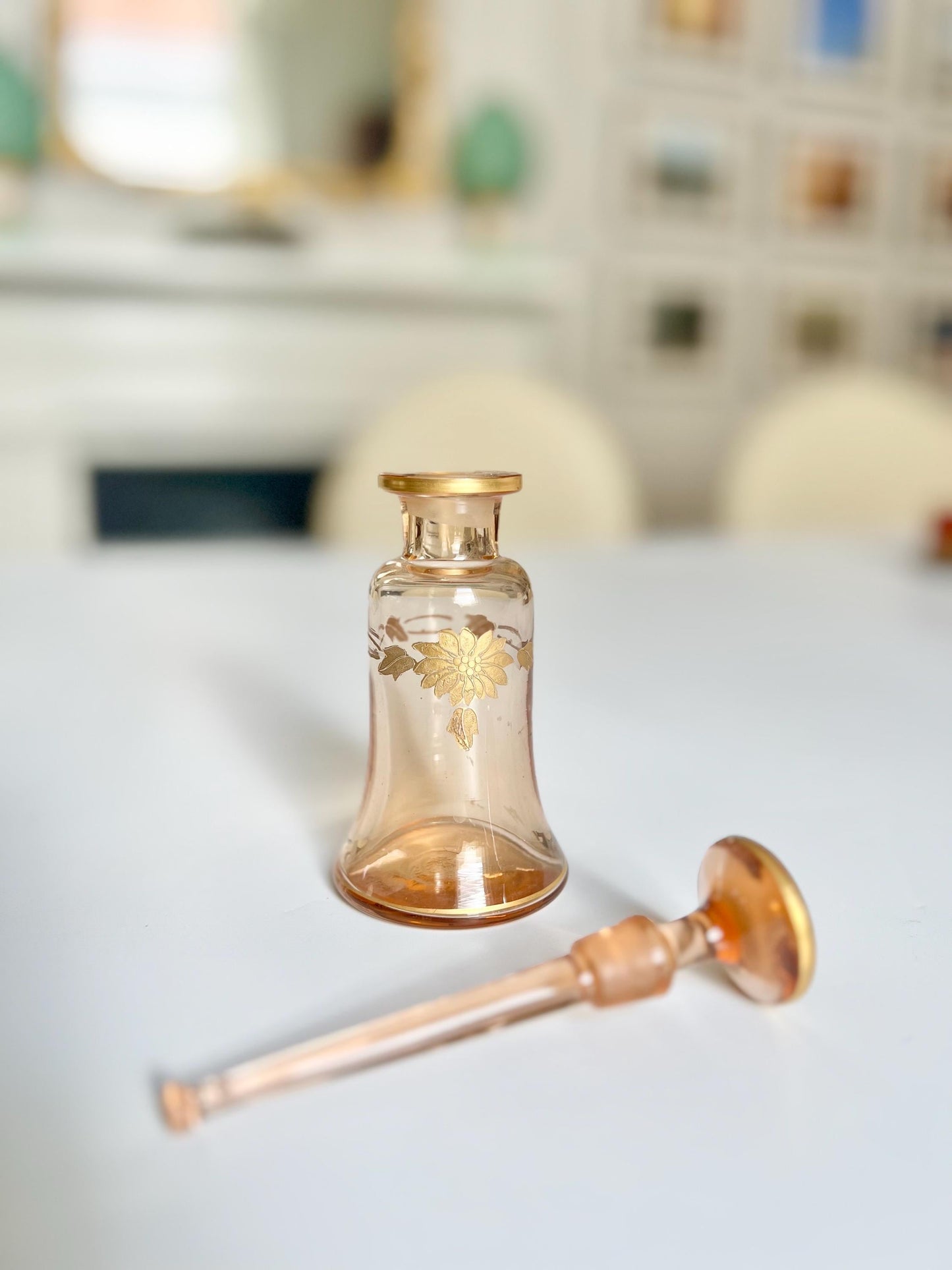 antique amber perfume bottle with gold detailing