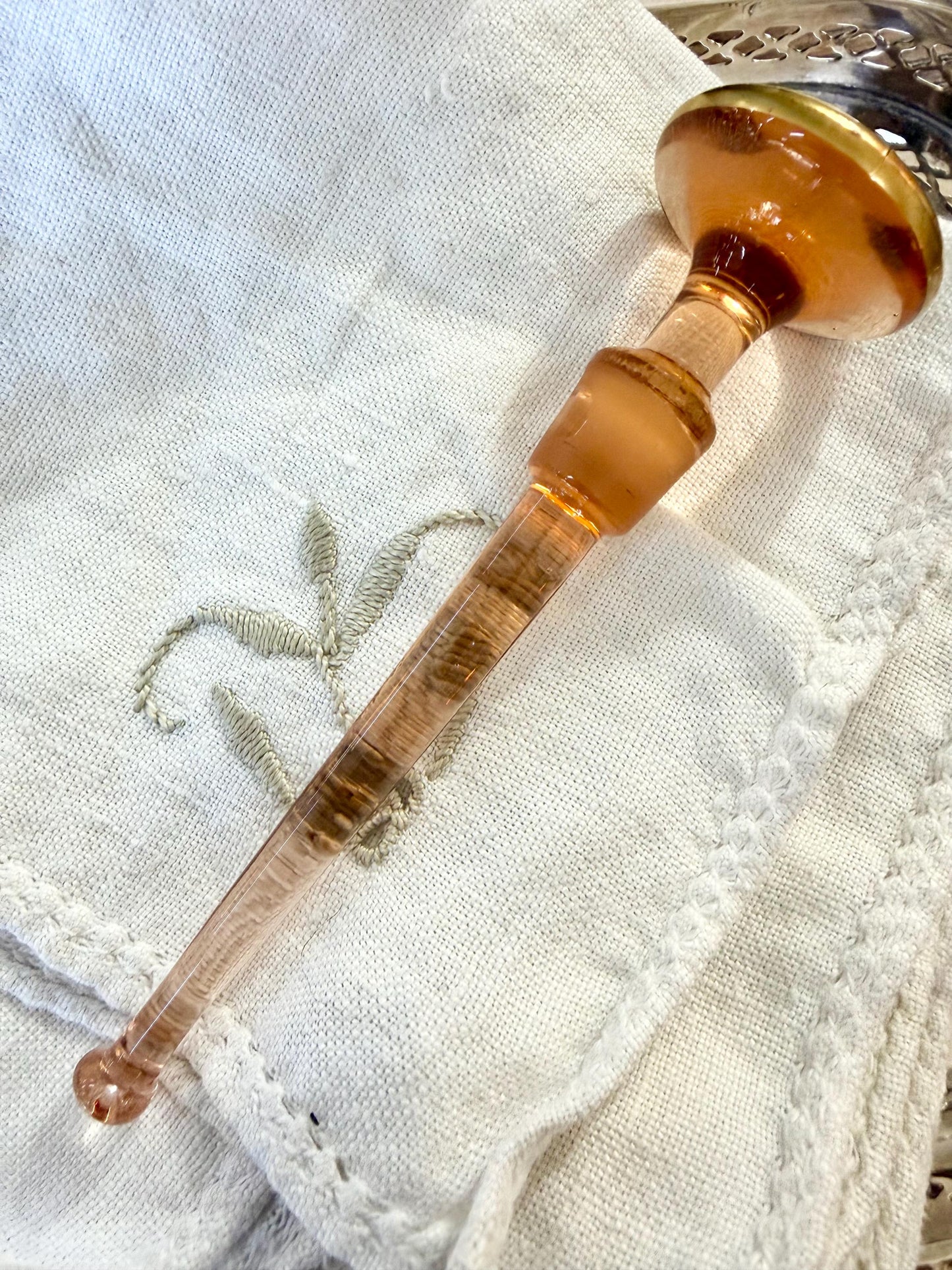 antique amber perfume bottle with gold detailing