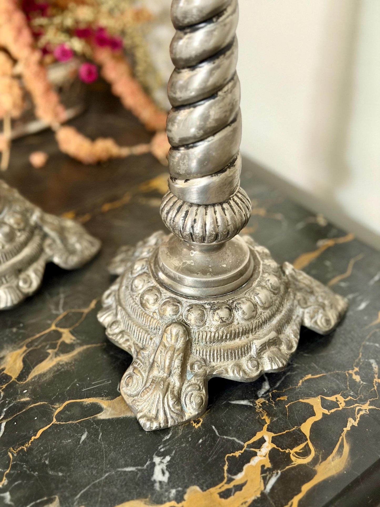 pair of silver plate ornate twisted candlesticks