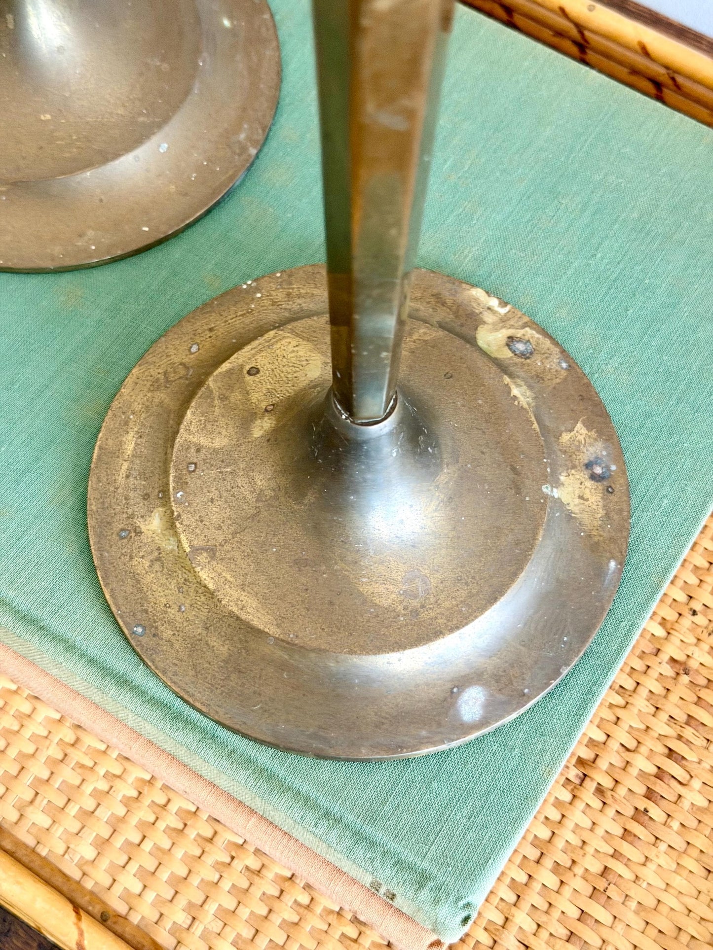 pair of tall brass arts and crafts candlesticks