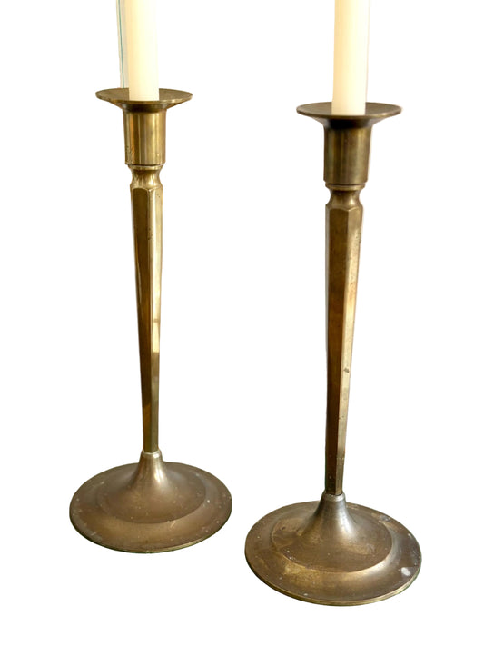 pair of tall brass arts and crafts candlesticks