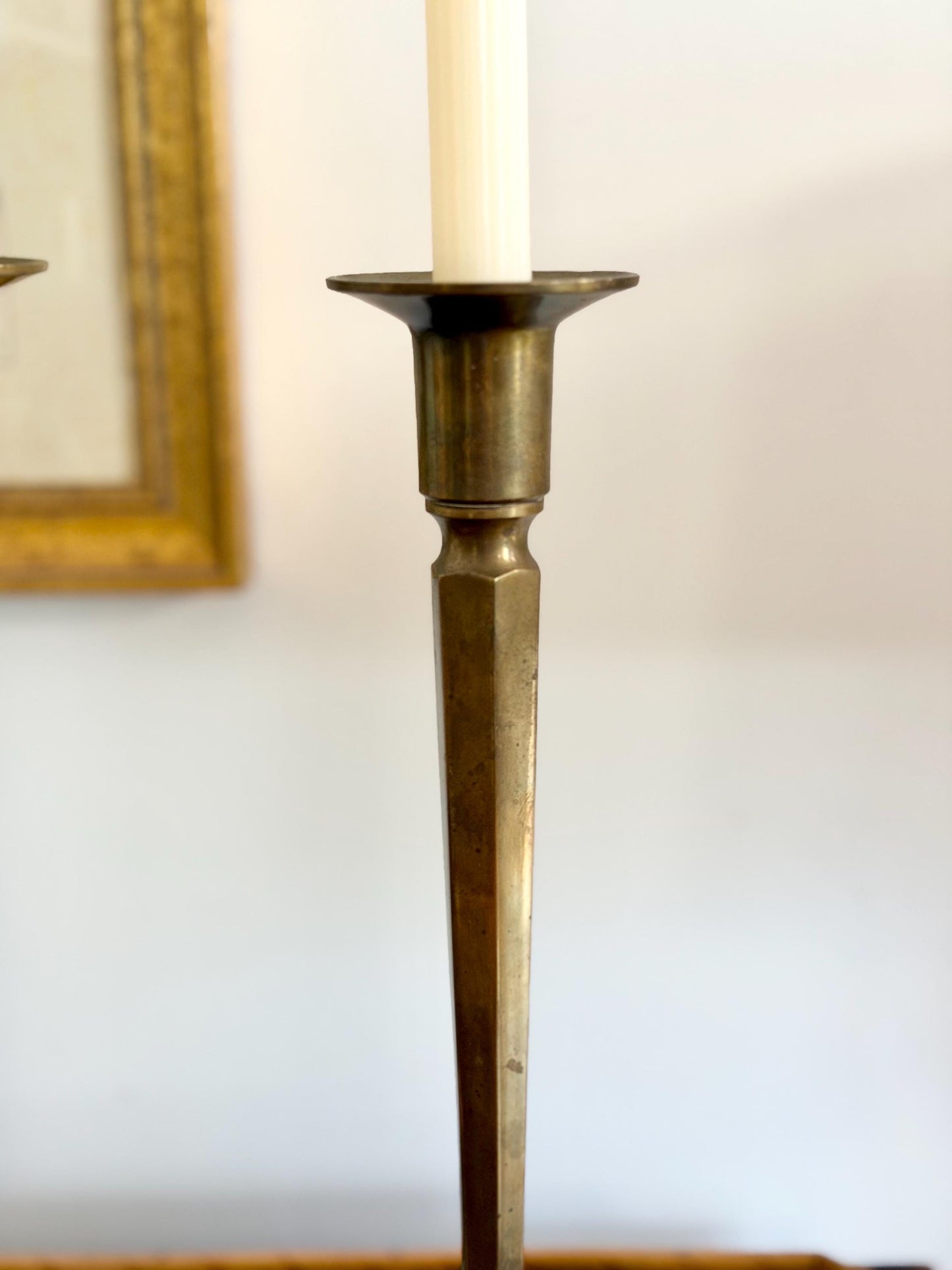 pair of tall brass arts and crafts candlesticks