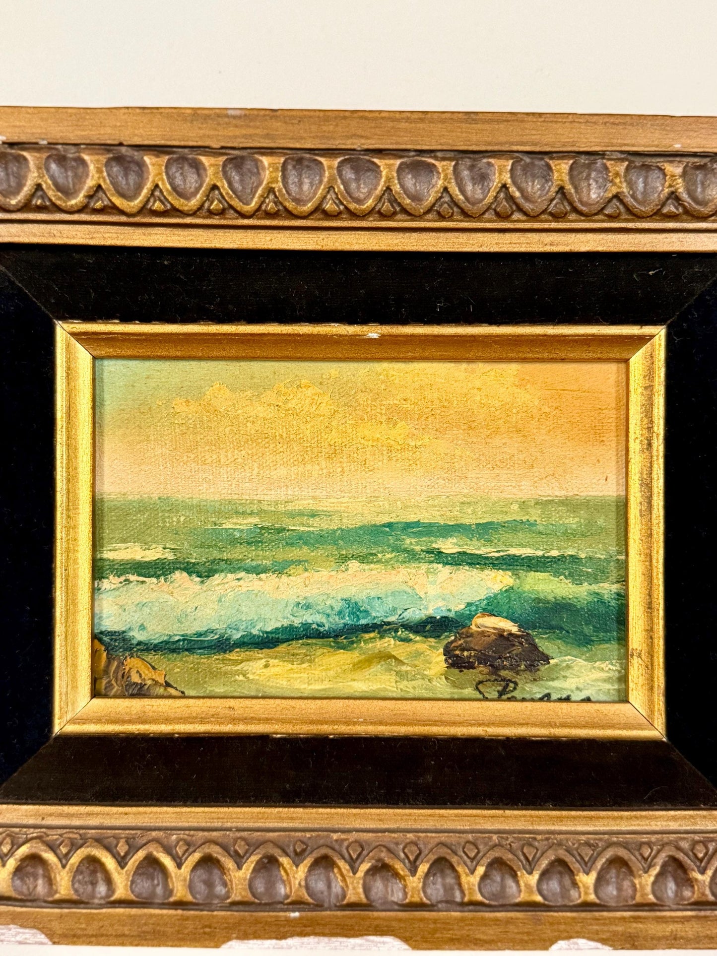 seaside oil painting in chippy wood frame with black velvet matting
