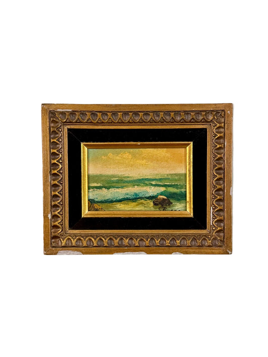 seaside oil painting in chippy wood frame with black velvet matting