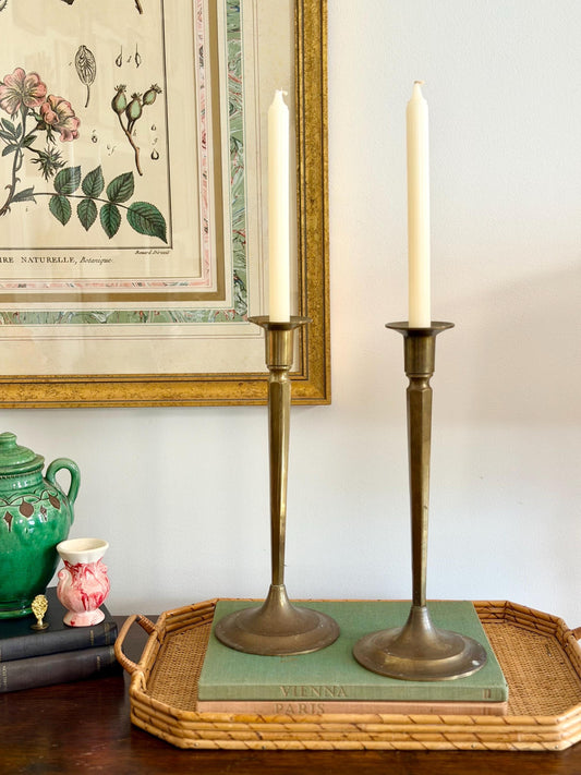 pair of tall brass arts and crafts candlesticks